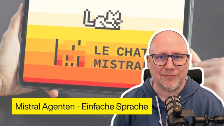 Porträt einer Person mit Mikrofon vor einem Tablet mit dem Logo „Le Chat Mistral“ und dem Titel „Mistral Agenten – Einfache Sprache“ in gelbem Banner.